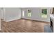 Spacious living room with hardwood floors, a front door with a glass accent, and natural light at 225 Hitchcock Dr, Villa Rica, GA 30180