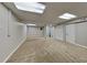 Spacious finished basement area with neutral paint, carpet flooring, and storage space at 2478 Wood Meadows Sw Dr, Marietta, GA 30064