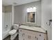 Bathroom features a granite countertop vanity and shower over tub at 2478 Wood Meadows Sw Dr, Marietta, GA 30064