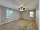 Spacious bedroom with carpet floors, ceiling fan and large windows, perfect for relaxation at 2478 Wood Meadows Sw Dr, Marietta, GA 30064