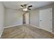 Comfortable bedroom with plush carpet, ceiling fan, and a view of the outdoors at 2478 Wood Meadows Sw Dr, Marietta, GA 30064