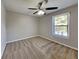 Bedroom with new carpet, ceiling fan and natural light from the large window at 2478 Wood Meadows Sw Dr, Marietta, GA 30064