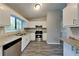 Modern kitchen with stainless steel appliances, granite countertops, and ample cabinet space at 2478 Wood Meadows Sw Dr, Marietta, GA 30064