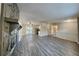 Spacious living room featuring an stone fireplace, new floors, and sliding doors to the backyard at 2478 Wood Meadows Sw Dr, Marietta, GA 30064