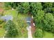 Aerial view of a home with a spacious yard, surrounded by lush trees and greenery at 252 Parkway Ct, Dallas, GA 30157
