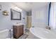 Bathroom with a corner soaking tub, vanity, and a shower, offering a relaxing and functional space at 252 Parkway Ct, Dallas, GA 30157