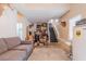 Bonus room with a couch, animal head decor and refrigerator near the staircase at 252 Parkway Ct, Dallas, GA 30157