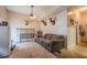 Bonus room with a couch, animal head decor and partial refrigerator at 252 Parkway Ct, Dallas, GA 30157