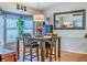 Bright dining area featuring a bay window, stylish table, and modern decor at 252 Parkway Ct, Dallas, GA 30157
