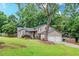 Charming home with a well-maintained front yard, beautiful tree, and inviting front porch at 252 Parkway Ct, Dallas, GA 30157