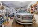 Spacious garage featuring a GMC vehicle and a motorcycle, filled with storage and tools at 252 Parkway Ct, Dallas, GA 30157