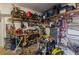 Cluttered garage filled with tools, equipment, and storage, showing ample space at 252 Parkway Ct, Dallas, GA 30157