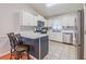 Well-lit kitchen with white cabinets, stainless steel appliances, and tile backsplash at 252 Parkway Ct, Dallas, GA 30157