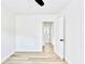 Bright bedroom features an open door, wood-look flooring, and white walls at 2502 Tupelo Se St, Atlanta, GA 30317
