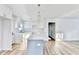 Bright, modern kitchen featuring a large island, white cabinets, and stainless steel appliances at 2502 Tupelo Se St, Atlanta, GA 30317
