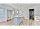Newly remodeled kitchen with center island, bright white cabinets and subway tile backsplash at 2502 Tupelo Se St, Atlanta, GA 30317