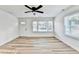 Bright living room with wood-look floors and a ceiling fan at 2502 Tupelo Se St, Atlanta, GA 30317