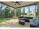 Covered back porch with comfortable seating and views of the backyard at 31 Thunderhawk Ne Ln, Rydal, GA 30171