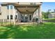 Spacious backyard featuring a covered back porch and partially fenced in yard at 31 Thunderhawk Ne Ln, Rydal, GA 30171