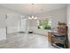 Bright dining area featuring neutral colors, wainscoting, and light wood flooring at 31 Thunderhawk Ne Ln, Rydal, GA 30171