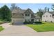 Charming two-story home boasts an attached garage, lush lawn, and welcoming curb appeal at 31 Thunderhawk Ne Ln, Rydal, GA 30171