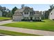 Traditional two-story home featuring a well-manicured lawn, attached garage, and inviting curb appeal at 31 Thunderhawk Ne Ln, Rydal, GA 30171