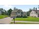 Beautiful two-story home featuring a manicured lawn, attached garage, and classic curb appeal at 31 Thunderhawk Ne Ln, Rydal, GA 30171