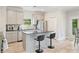 Modern kitchen features stainless steel appliances, stylish island, and ample cabinet space at 31 Thunderhawk Ne Ln, Rydal, GA 30171