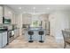 Bright kitchen features stainless steel appliances, stylish island, and ample cabinet space at 31 Thunderhawk Ne Ln, Rydal, GA 30171