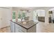 Open concept kitchen with central island and view of dining area and living room, perfect for entertaining at 31 Thunderhawk Ne Ln, Rydal, GA 30171