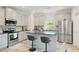 Modern kitchen features stainless steel appliances, stylish island, and ample cabinet space at 31 Thunderhawk Ne Ln, Rydal, GA 30171