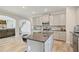 Modern kitchen with stainless steel appliances, sleek countertops, island and open layout at 31 Thunderhawk Ne Ln, Rydal, GA 30171