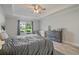 Bright main bedroom with gray curtains, tray ceiling, and a window nook for reading at 31 Thunderhawk Ne Ln, Rydal, GA 30171
