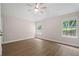 Cozy bedroom with ceiling fan, dual windows and hardwood floors at 425 Greenmont Walk Ct, Alpharetta, GA 30009
