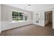Bright dining area with hardwood floors, trim detail, and large window overlooking the backyard at 425 Greenmont Walk Ct, Alpharetta, GA 30009