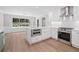 Bright kitchen featuring stainless steel appliances, quartz countertops, and ample storage at 425 Greenmont Walk Ct, Alpharetta, GA 30009