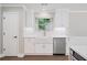 Well-lit kitchen with stainless steel appliances, undermount sink and ample counter space at 425 Greenmont Walk Ct, Alpharetta, GA 30009