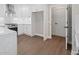Spacious kitchen with stainless steel appliances, white cabinets, and hardwood floors at 425 Greenmont Walk Ct, Alpharetta, GA 30009