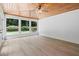 Relaxing sunroom with wood ceiling, many windows and backyard view at 425 Greenmont Walk Ct, Alpharetta, GA 30009