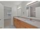 Bathroom featuring double vanity with wood cabinets and light countertops at 4401 Belcamp Rd, Union City, GA 30213