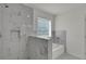 Modern bathroom with tiled walk-in shower and tub at 4401 Belcamp Rd, Union City, GA 30213