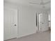 Spacious bedroom with neutral carpet, ceiling fan and closet at 4401 Belcamp Rd, Union City, GA 30213