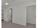 Clean, carpeted bedroom with open closet and ensuite bathroom at 4401 Belcamp Rd, Union City, GA 30213