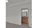 A bright, neutral bedroom with a door that leads to the en-suite bathroom at 4401 Belcamp Rd, Union City, GA 30213