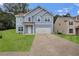 Charming blue two-story home with a well-manicured lawn and a two car garage at 4401 Belcamp Rd, Union City, GA 30213