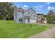 Inviting blue two-story home with a driveway and a lush green lawn at 4401 Belcamp Rd, Union City, GA 30213