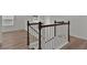 Staircase with white railing and dark wood trim, complemented by light wood floors, offers a bright transition between levels at 4401 Belcamp Rd, Union City, GA 30213