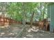 Large backyard features mature trees, wooden fencing, and a storage shed at 5037 Laurel Springs Se Way, Smyrna, GA 30082