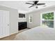 Bright bedroom with a ceiling fan, a dark dresser, and ample natural light from two windows at 5037 Laurel Springs Se Way, Smyrna, GA 30082