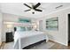 Spacious bedroom featuring a ceiling fan, light gray walls and a large window at 5037 Laurel Springs Se Way, Smyrna, GA 30082